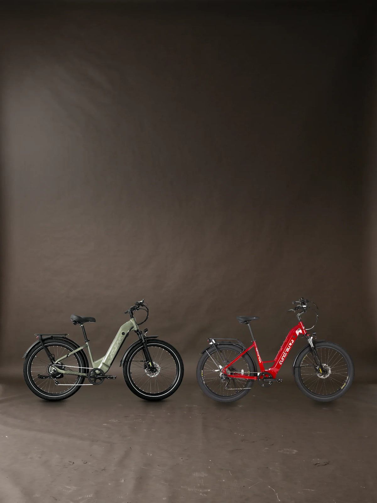 Aventon Level 3 review banner: two bikes we sell that match it, the VTUVIA Zeal LT7 in Olive Green and the Eunorau META275 2.0 in Deep Crimson, each its maker's own photograph, side by side in a photographic studio