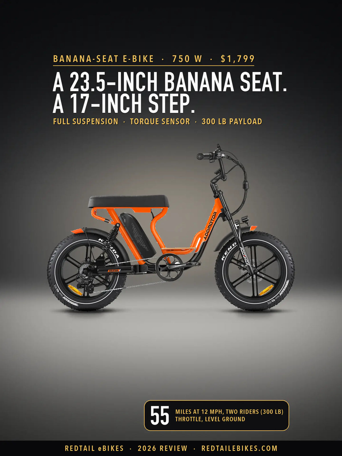 Addmotor Soletan M-66X in Orange on a lit studio floor against a dark wall, side view, with its long black banana seat over the battery, a wooden footboard, a coil rear shock and black fat tires