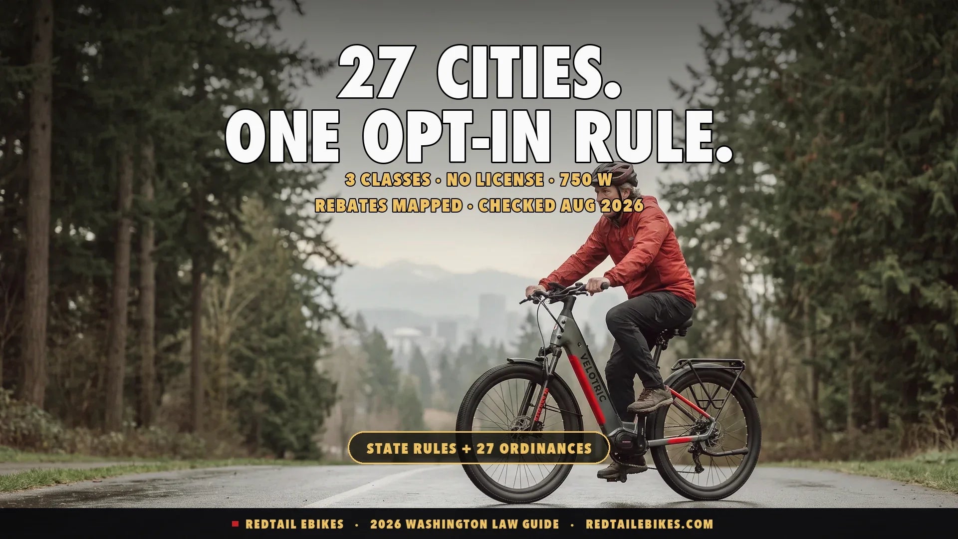 Rider on an electric bike on a Pacific Northwest shared-use trail with evergreen forest and mountains behind