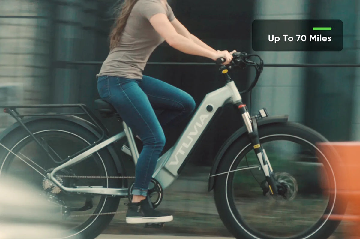 Rider on a silver Reindeer 2.0 on a paved path