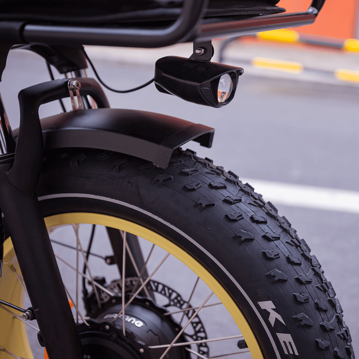 Close-up of the Silverado HD's front fat tire, fender and headlight