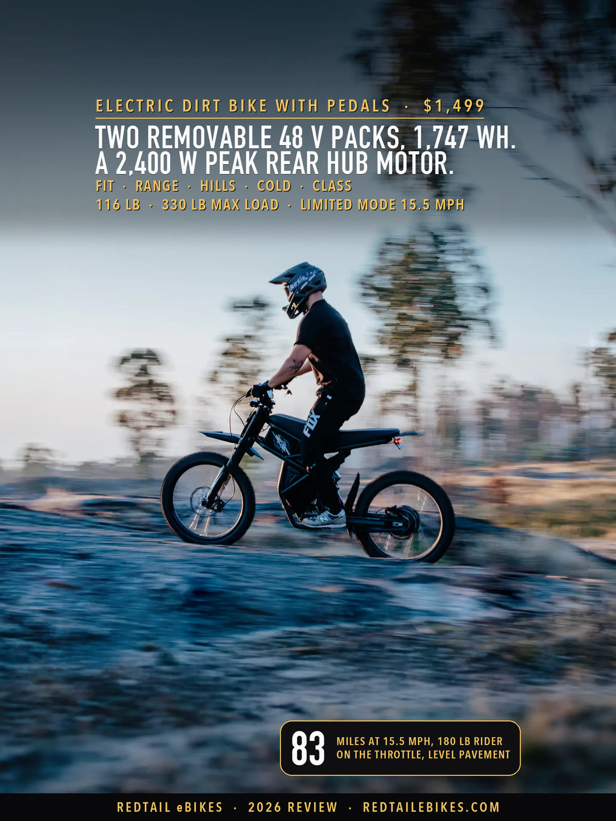 A rider in a full-face helmet and gloves on the Riding'times GT73 electric dirt bike with pedals, crossing a rock slab at dusk, the trees behind him streaked by the camera's pan