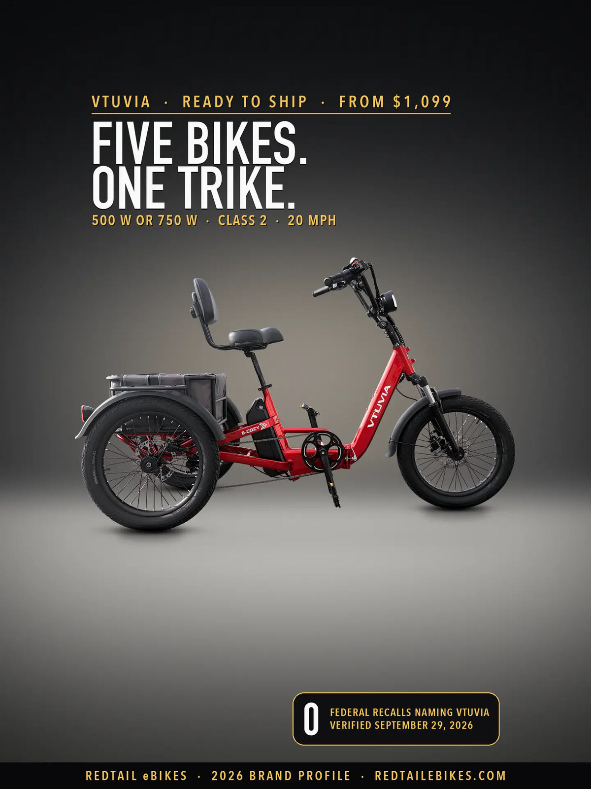 VTUVIA E-Cozy electric trike in Ruby Red on a lit studio floor against a dark wall, side view, on the VTUVIA brand profile