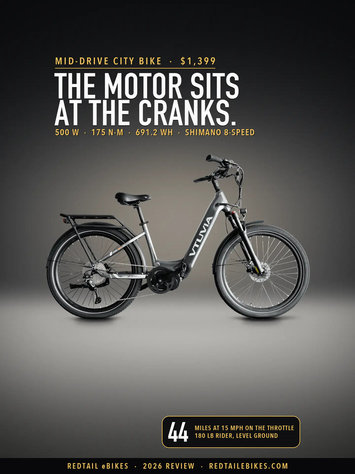 VTUVIA CMB 8-Speed in Metallic Silver on a lit studio floor against a dark wall, side view, under the headline The motor sits at the cranks. and a badge reading 44 miles at 15 mph on the throttle, 180 lb rider, level ground