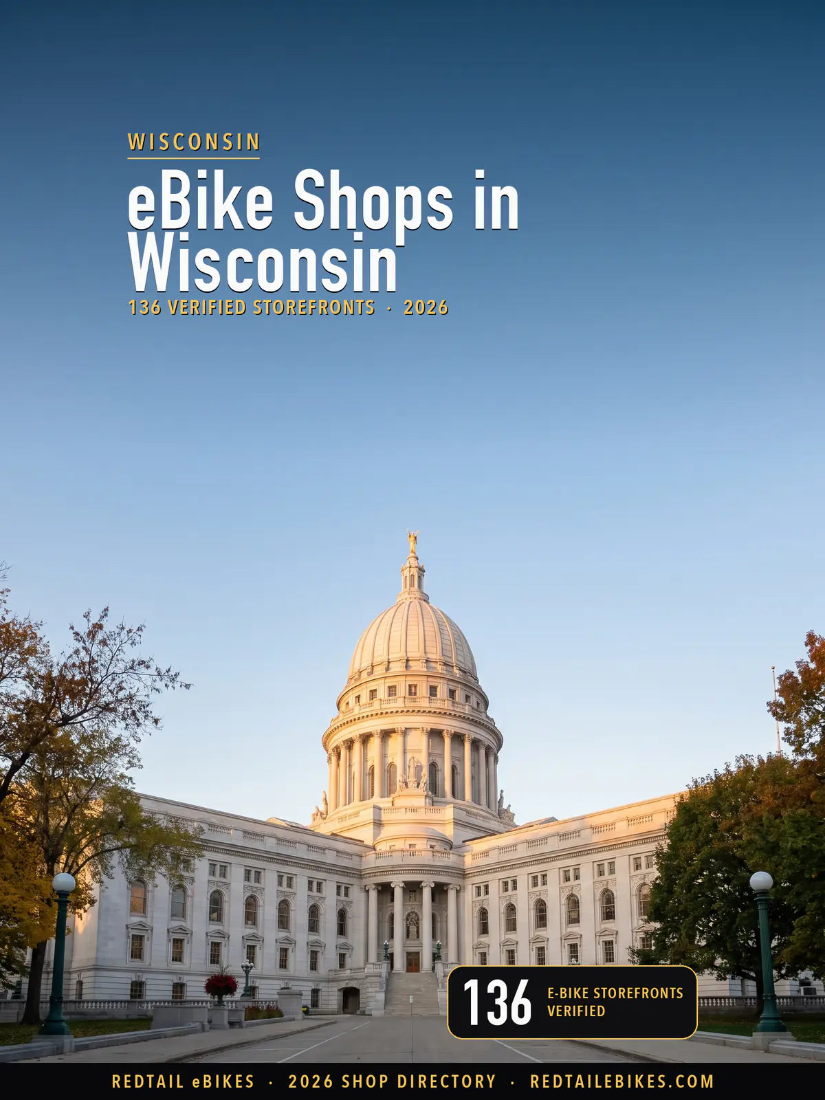 The Wisconsin State Capitol in Madison, its white granite dome and gilded statue in late-afternoon light above an empty drive lined with lamp posts and trees, with the cover headline eBike Shops in Wisconsin and 136 verified storefronts