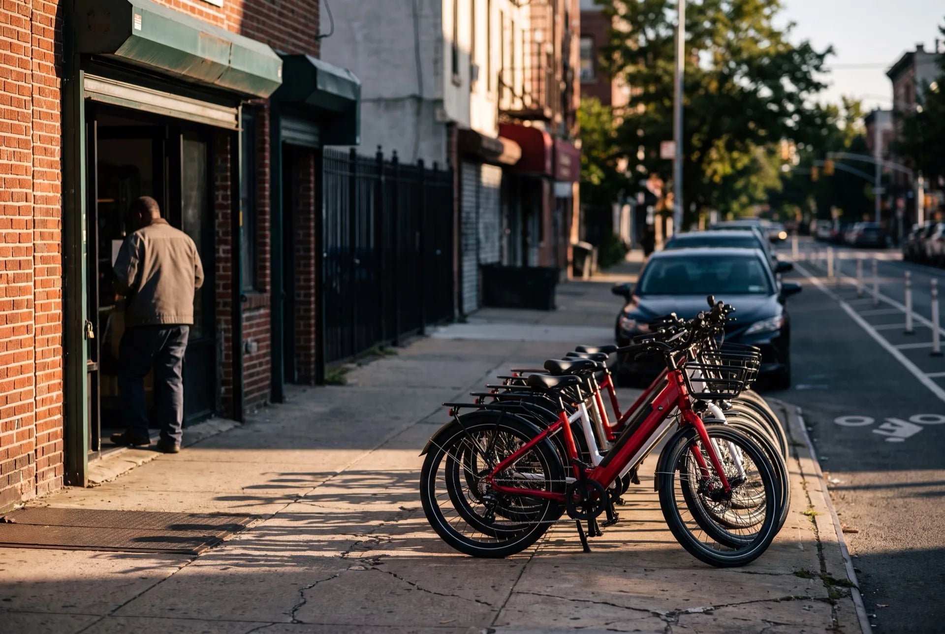 Row of electric bikes outside an ebike store in NYC on a Brooklyn street