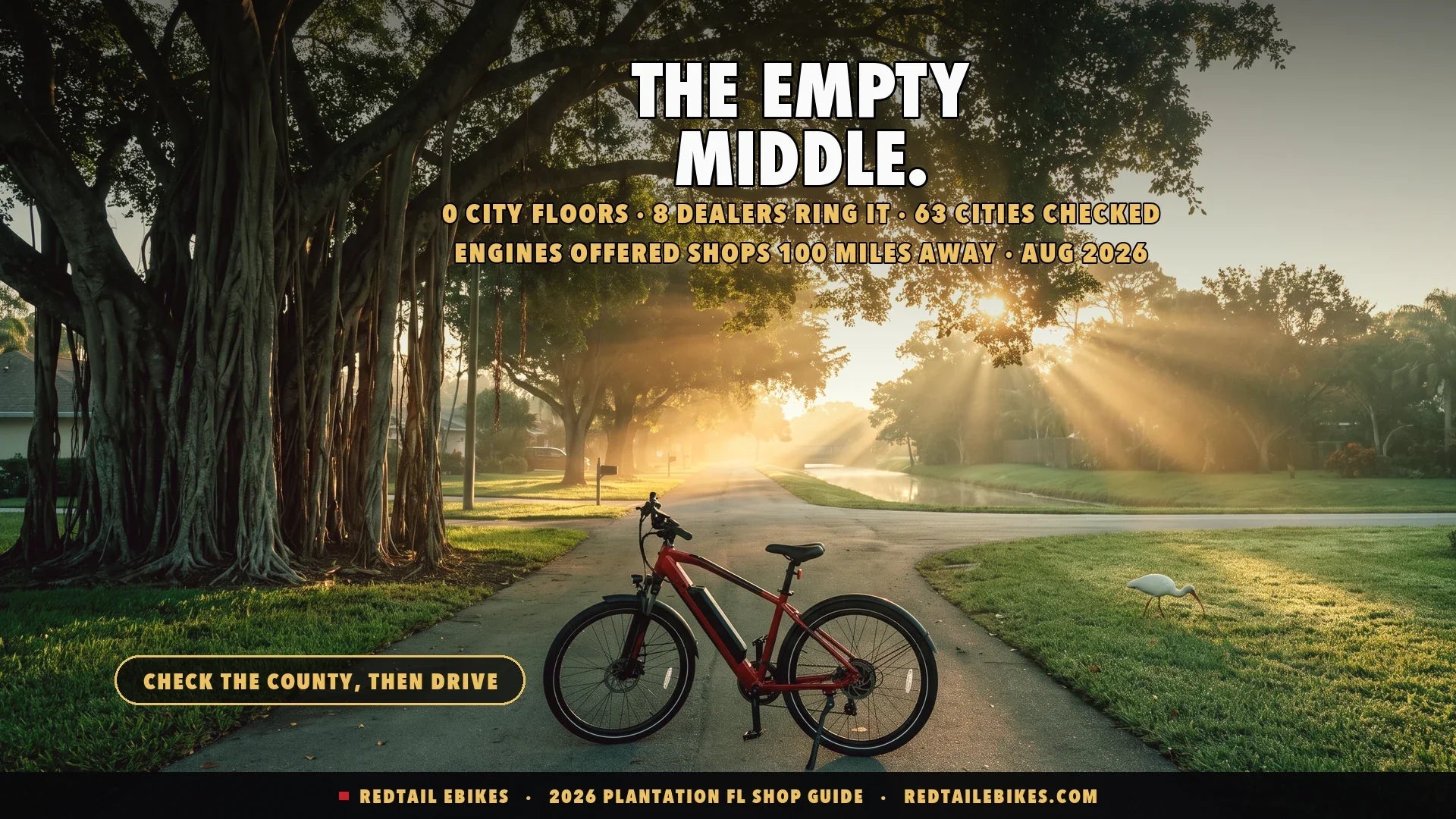 Electric bike under a giant banyan tree on a shaded Plantation street at dawn with a canal and white ibis behind