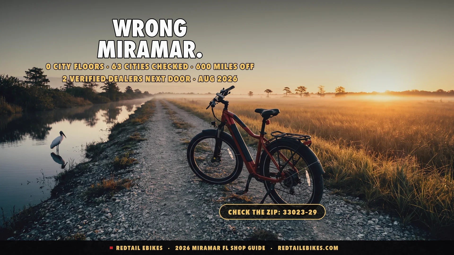 Electric bike on a levee path at the Everglades edge of Miramar at dawn with sawgrass and a wood stork