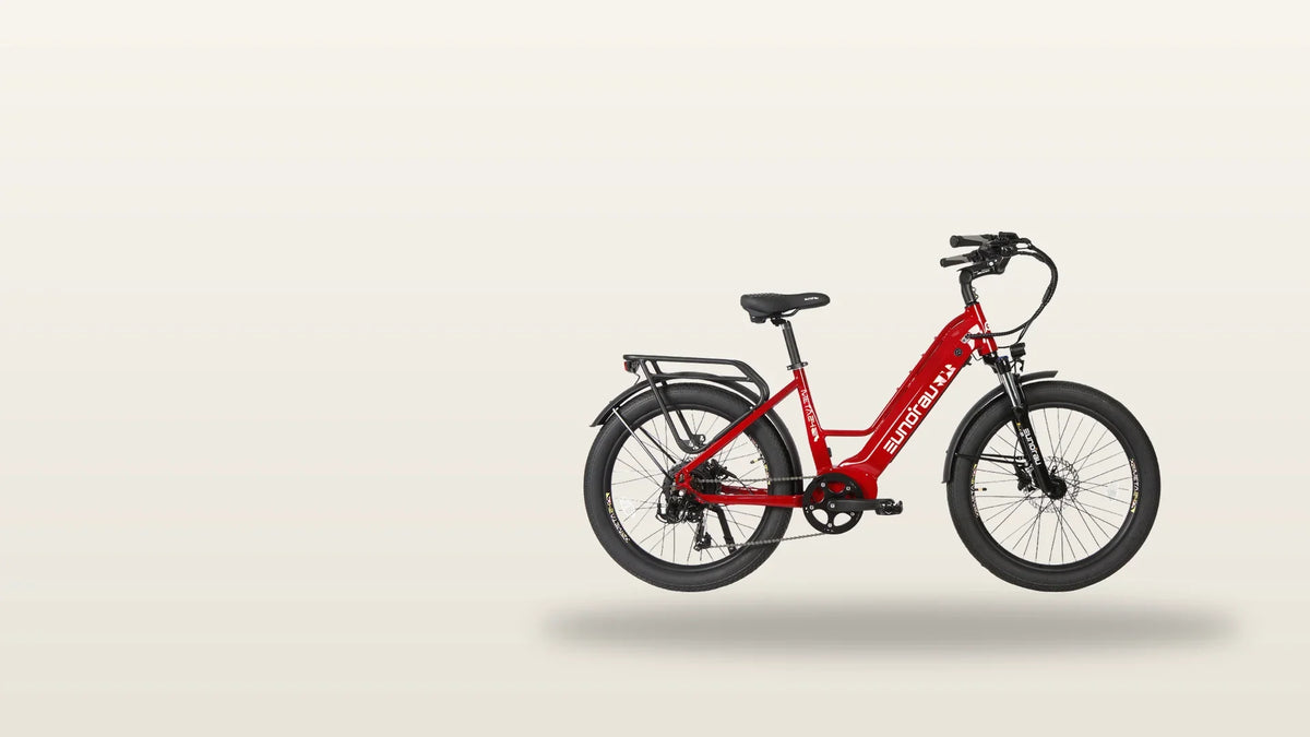 Eunorau META platform step-through city electric bike in deep crimson, studio side profile showing the step-through frame, rear rack and downtube battery