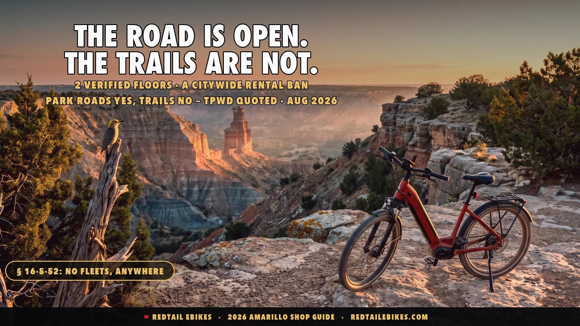 Red step-through electric bike at the rim of Palo Duro Canyon near Amarillo Texas at sunrise with red rock hoodoos in morning haze and a golden-fronted woodpecker on a juniper snag