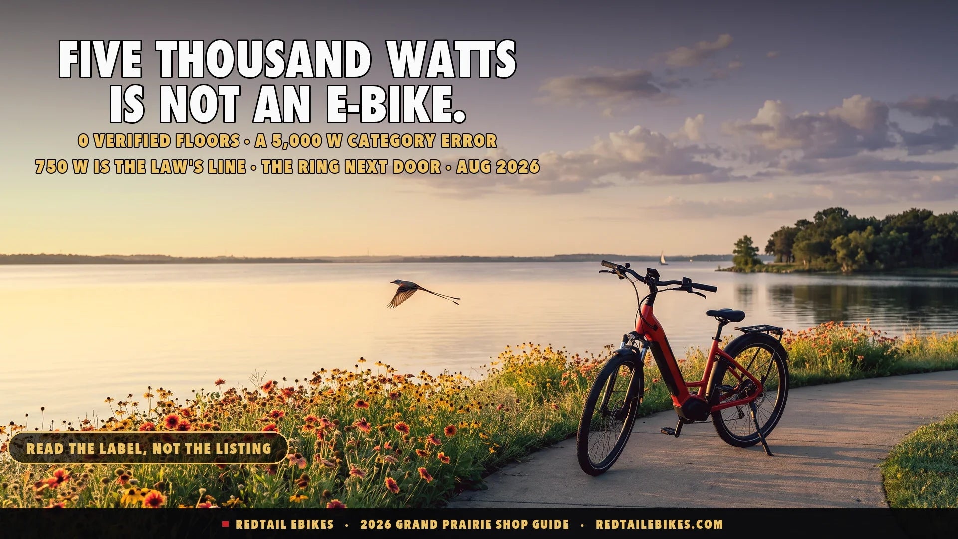 Red step-through electric bike on the Lynn Creek shoreline path at Joe Pool Lake in Grand Prairie Texas at sunrise with prairie wildflowers and a scissor-tailed flycatcher over the water