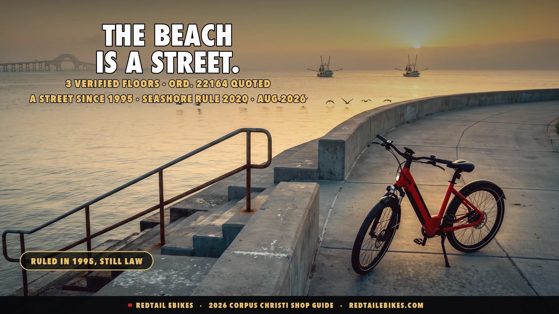 Red step-through electric bike on the Corpus Christi seawall at sunrise with pelicans over the bay and shrimp boats heading out