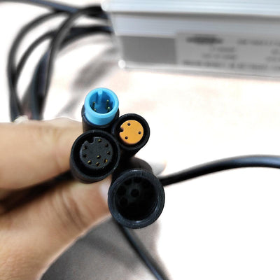 The controller's connectors held in a hand