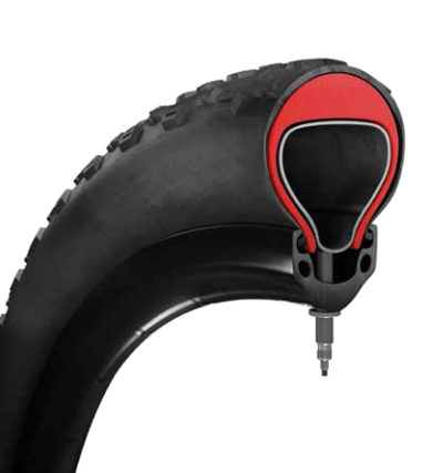 Cutaway of a Tannus Armour insert between a fat tire and its tube