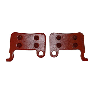 Two red hydraulic brake pads