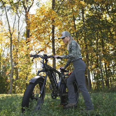 Hunter walking an SN100 through autumn woods