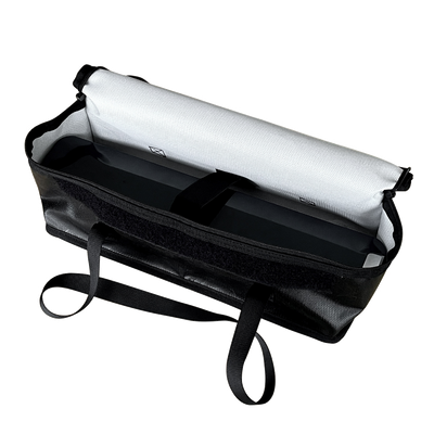 VTUVIA fireproof battery bag open, showing the silver fire-retardant lining and a carry strap