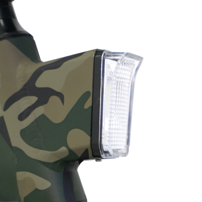 The headlight housing on a camouflage frame