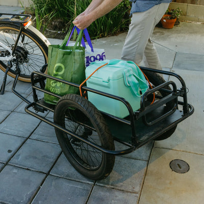 The trailer loaded with shopping bags and a cooler