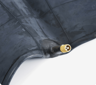 Close-up of the 20 × 4.0-inch inner tube's valve