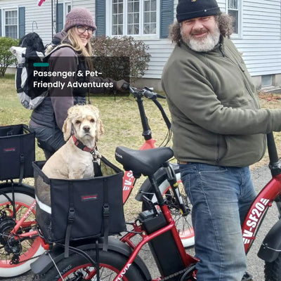 Couple with a dog in the front basket of a red SF20H outside a house