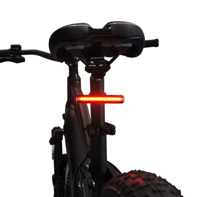 VTUVIA rear light under a saddle, lit red